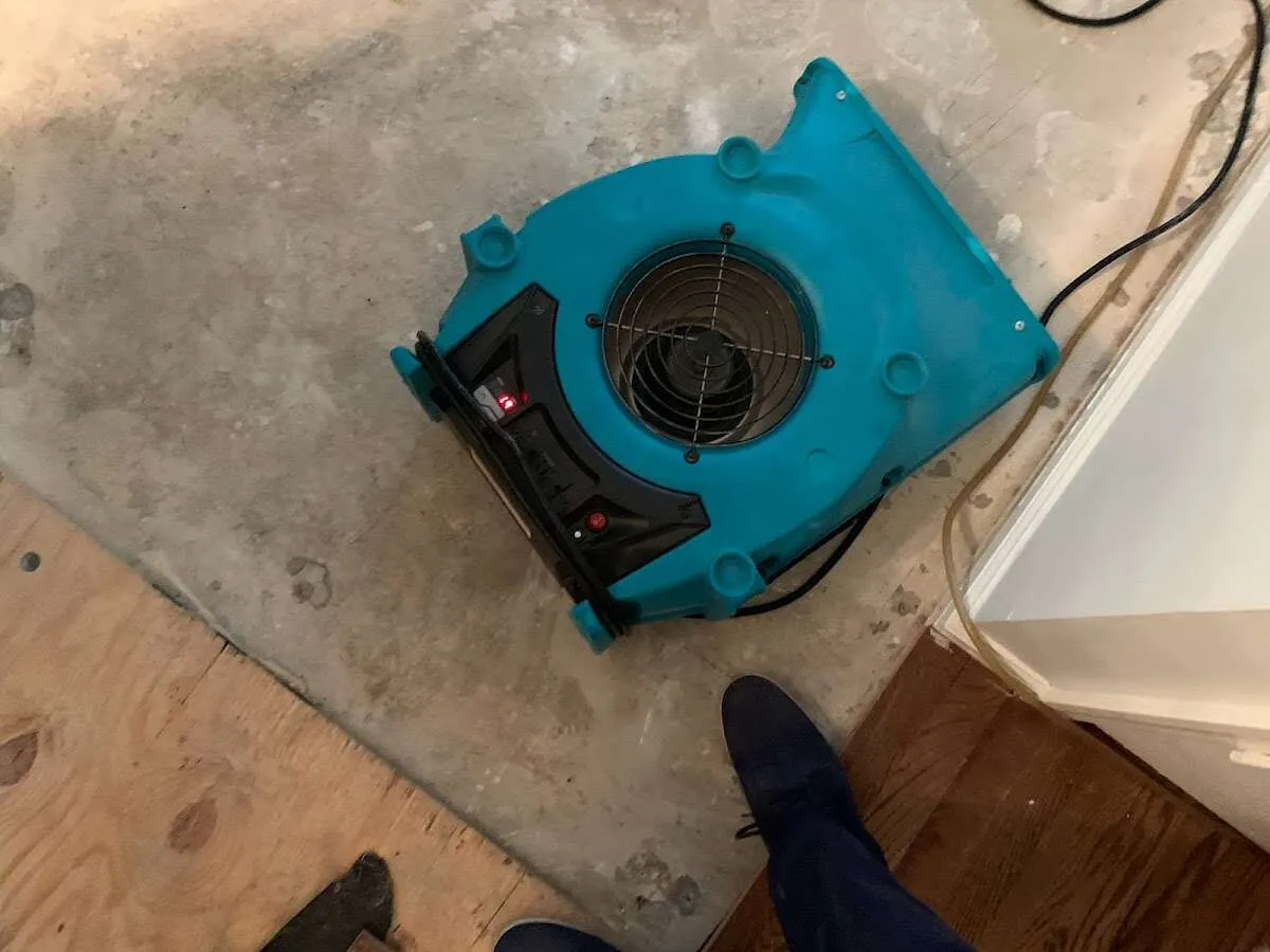 Air mover drying subfloor during Leak Detection & Repair in El Reno